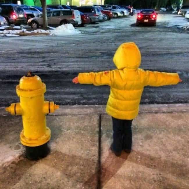 fire_hydrant_and_boy_wearing_yellow_jacket_look_alike