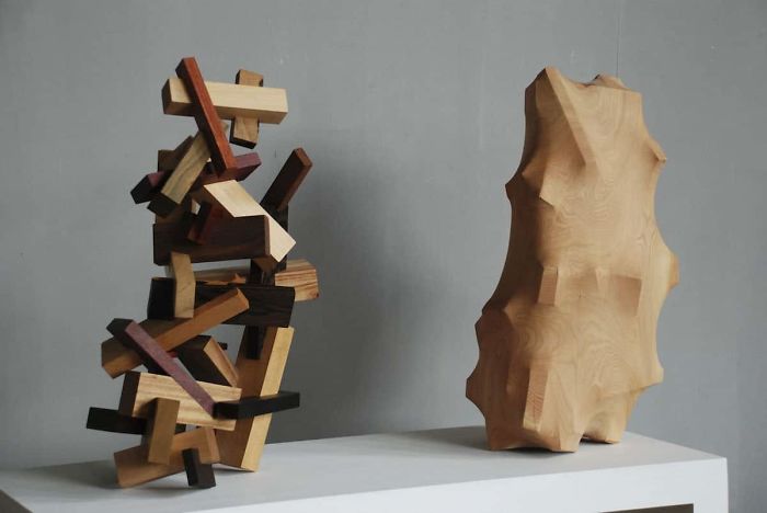maravillosas esculturas de madera transforman la barbilla ming dentro del bosque