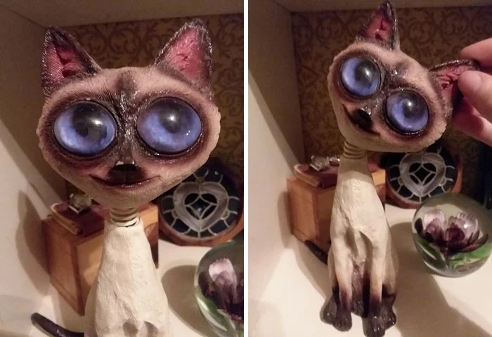 gran figura de ojos de gato espeluznante